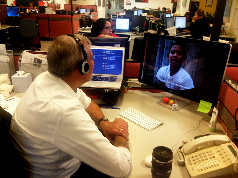 Photographer Dario Lopez Mills looking at the video edit to give his feedback.